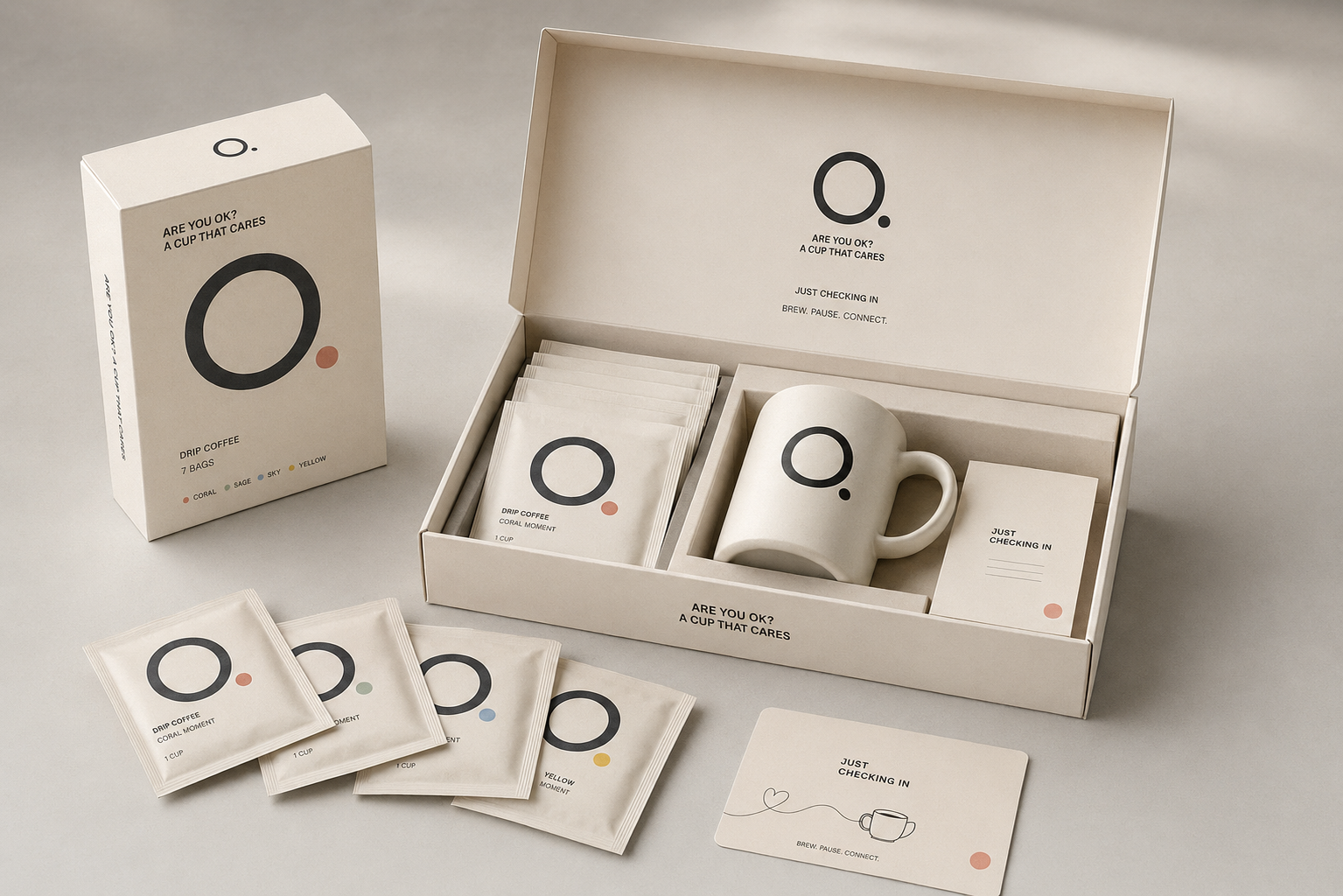 The Are You Ok? Care Box — an open gift box holding drip coffee sachets, a mug and a message card, with loose sachets in coral, sage, sky and yellow